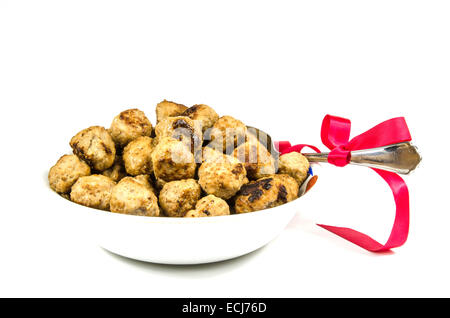 Fleischbällchen in einer Schüssel mit einem Weihnachten dekoriert Löffel Stockfoto