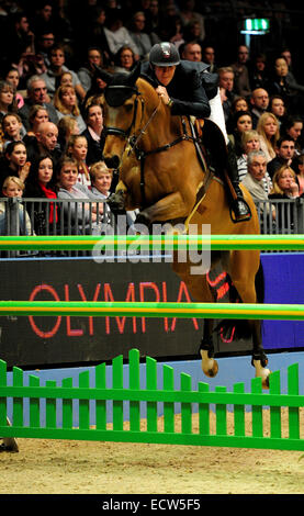 London, UK. 19. Dezember 2014. London Olympia Horse Show. Die Longine Christmas Cracker Jos Verlooy auf Domino belegte den 3. Platz Credit: Action Plus Sport/Alamy Live News Stockfoto