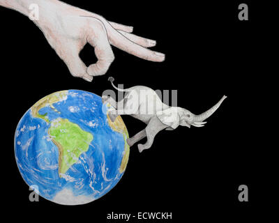 Menschliche Hand dreht Elefant von Globe. Wir brachten diese Spezies aussterben. Stockfoto