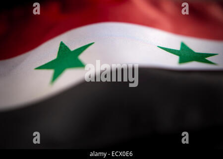 Makro-Ansicht der syrischen Flagge mit geringen Schärfentiefe zu abstrahieren. Stockfoto