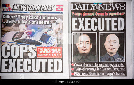 New York, USA. 21. Dezember 2014. Die New York Daily News und die New York Post berichten über Sonntag, 21. Dezember 2014 über die Ermordung von zwei NYPD Offiziere, Wenjian Liu und Rafael Ramos durch Ismaaiyl Brinsley.  Die Offiziere wurden in Brooklyn in ihre Streifenwagen von Brinsley angeblich als Vergeltung für den Tod von Eric Garner ermordet. Brinsley tötete sich in der u-Bahn während seiner versuchte Flucht Credit: Richard Levine/Alamy Live News Stockfoto