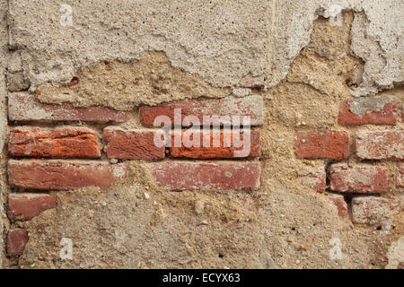 Alte Mauer mit rissigen Putz. Hintergrundtextur. Stockfoto