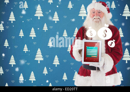 Santa präsentiert einen Tablet-PC Stockfoto