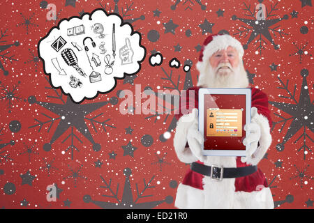 Zusammengesetztes Bild von Santa präsentiert einen TabletPC Stockfoto