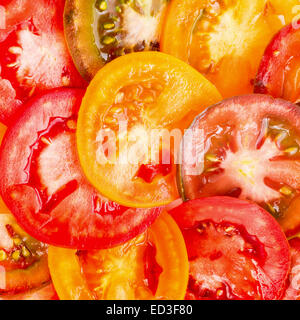 Großen abstrakten Hintergrund der gesunden Naturkost verschiedener Farbe Tomatenscheiben, frische Bio-Lebensmittel Stockfoto