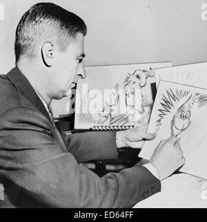 Dr. Seuss (Ted Geisel) bei der Arbeit auf einer Zeichnung von einem Grinch für "How the Grinch Stole Christmas," 1957 Stockfoto