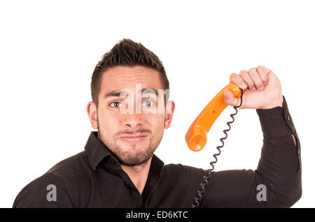 Closeup Portrait von schöner hispanic Mann reden auf Retro-Telefon mit Schnur Stockfoto