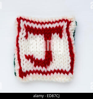 Buchstabe J gestrickte wollene Schriftzug. Stockfoto