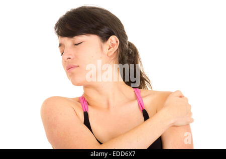 junge schöne Frau mit Schmerzen in der Schulter Stockfoto