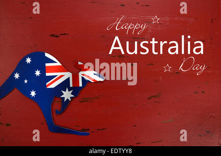 Australia Day Hintergrund mit Känguru Form australische Flagge auf rotem rustikale recyceltem Holz Hintergrund mit Beispieltext. Stockfoto