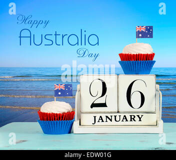 Glücklich Australia Day, 26. Januar, Holz Vintage Kalender Theme weiß und rot, weiße und blaue Cupcakes Stockfoto