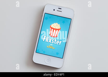 Der Homescreen und das Logo von Flixster mit Rotten Tomatoes mobile app auf einem weißen Apple iPhone 4. Stockfoto