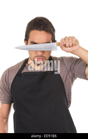 gut aussehend männlichen Jungkoch trägt schwarze Schürze Stockfoto