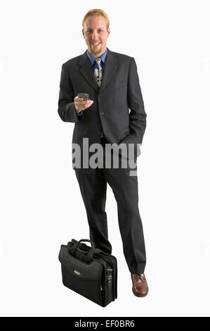 Geschäftsmann mit einem Mobiltelefon Stockfoto