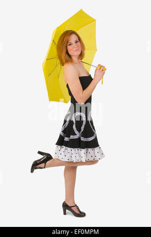 Frau Kostüm trägt und hält Regenschirm Stockfoto