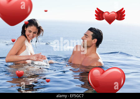 Zusammengesetztes Bild des jungen Paares spielen Stockfoto