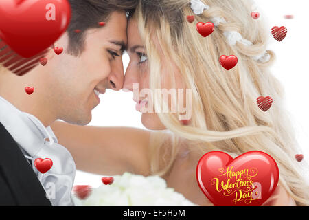 Zusammengesetztes Bild glückliches junges Ehepaar suchen einander ins Gesicht Stockfoto