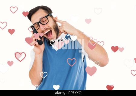 Zusammengesetztes Bild geeky Hipster sprechen auf eine Retro-Handy Stockfoto