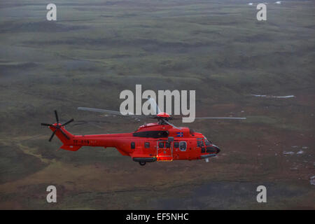 Luftbild-tf-syn, Suche und Rettung Hubschrauber fliegen von Gullfoss Wasserfall, Island. Stockfoto