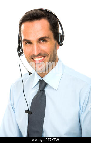 Porträt von ein lächelnder Mann mit Kopfhörer arbeitet als ein Call-Center-Betreiber Stockfoto