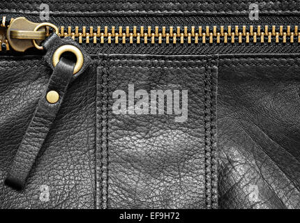 Schwarzes Leder Tasche Teil mit Reißverschluss für Hintergrund Stockfoto