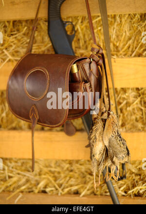 Jagd-Ledertasche mit einem Wachteln Stockfoto