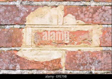 Nahaufnahme von einer Fläche von Verschleiß an eine Mauer Stockfoto