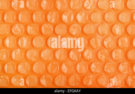 Orange Kunststoff Bubble Wrap Hintergrund Stockfoto