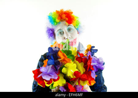 Frau im Clown Perücke und Make-up mit einem traurigen Ausdruck in hoher Ton Stockfoto