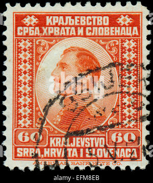 Jugoslawien - ca. 1921: Eine Briefmarke gedruckt in Jugoslawien (Königreich Serbien, Kroatien und Slawonien) zeigt Porträt von König Alexander ich Stockfoto