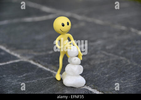 Gelber Smiley-Mann im Urlaub in den äußeren Hebriden - hier hat er Stockfoto