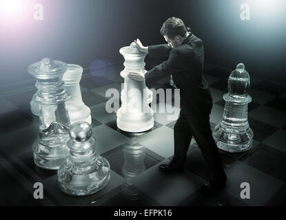 Geschäftsmann auf einem Schachbrett als dummy Stockfoto