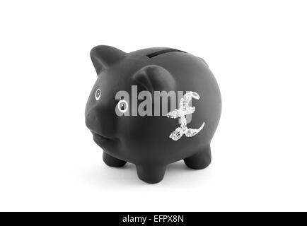 Schwarzes Sparschwein mit Pfund-Zeichen. Clipping-Pfad enthalten. Stockfoto