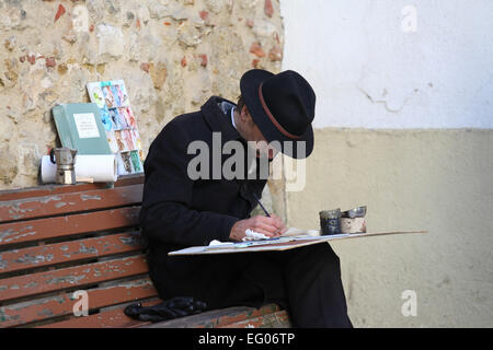 Streetart-Künstler in Lissabon, der malt mit Kaffee Stockfoto