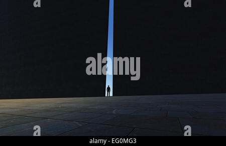 Eine einsame Person zu Fuß durch einen schmalen Durchgang gemacht in 3d software Stockfoto