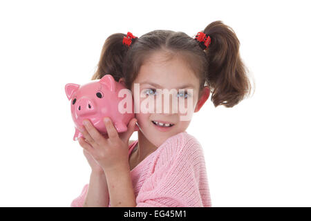 Kind mit Einsparungen im Sparschwein Spardose Stockfoto