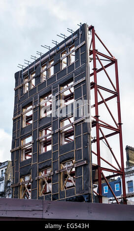 Die Oxford Street, London, UK. Die Technik der "facadism' - die Fassade eines alten Gebäudes beibehalten, Neubau Platz hinter dauert es Stockfoto