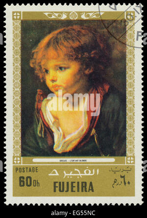 FUJEIRA - ca. 1972: Briefmarke gedruckt von Fujeira, zeigt ein Gemälde von Greuze - L'enfant Blondine, ca. 1972 Stockfoto