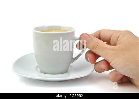Hand und eine Tasse Kaffee auf hellem Hintergrund Stockfoto