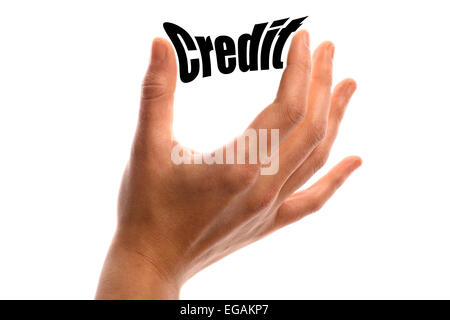 Horizontalen Schuss einer Hand drückte das Wort "Kredit" zwischen zwei Fingern, isolated on White. Stockfoto