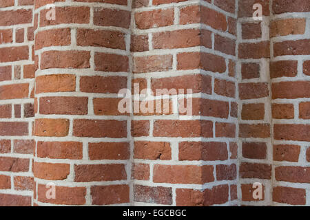 Ziegelwand Hintergrund mit Formen aus einer Spalte Stockfoto