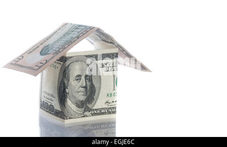 Dollar und Pfund Häuser isoliert auf weiß. Stockfoto