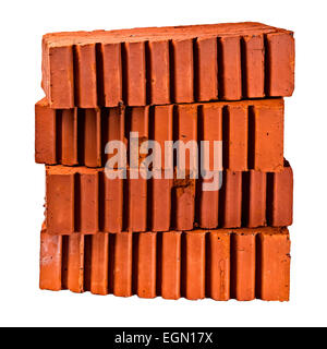 Stapel von vier Bau-, Baustoff-, gemeinsame, strukturelle Ziegel der orange Farbe auf weißen Hintergrund isoliert. Stockfoto