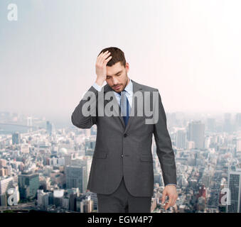 gut aussehend Geschäftsmann mit Kopfschmerzen Stockfoto