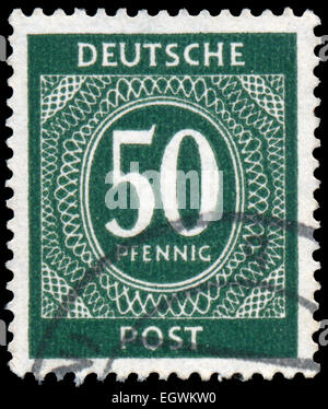 Deutschland - CIRCA 1946: Briefmarke gedruckt in der Bundesrepublik Deutschland (BRD) zeigt ein weiße Muster auf grünem Hintergrund. ca. 1946 Stockfoto