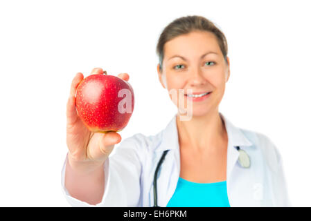Frau Doktor zeigt einen schönen roten Apfel Stockfoto