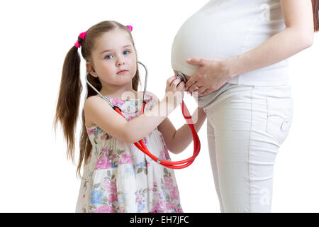 Kind Mädchen schwangere Mutter Bauch hören Stockfoto