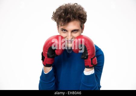 Geschäftsmann in Boxhandschuhe über grauen Hintergrund Stockfoto
