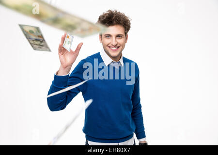 Glücklicher Mann genießen einen Regen von Geld Stockfoto