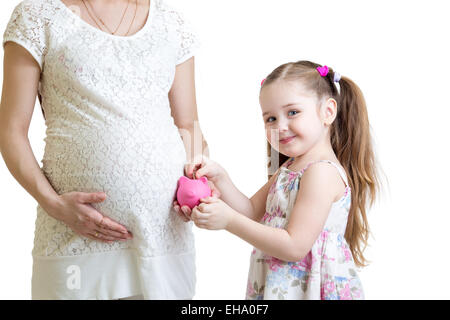 Schwangere Mutter und Kind Sparschwein Münzen Inbetriebnahme Stockfoto